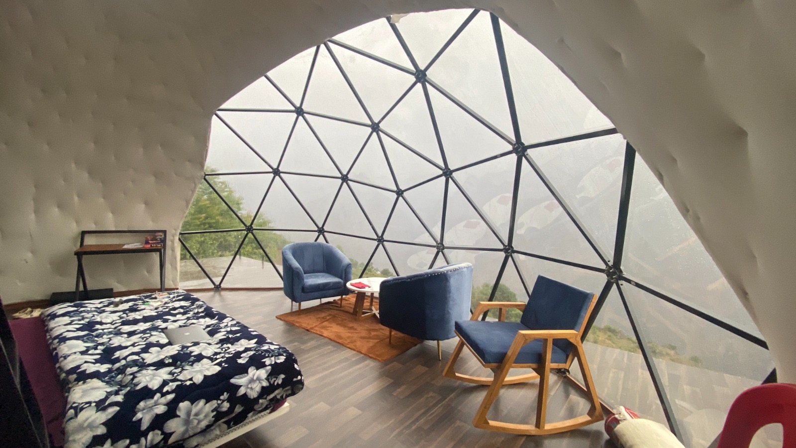 Dome House exterior on its wooden deck overlooking the valley
